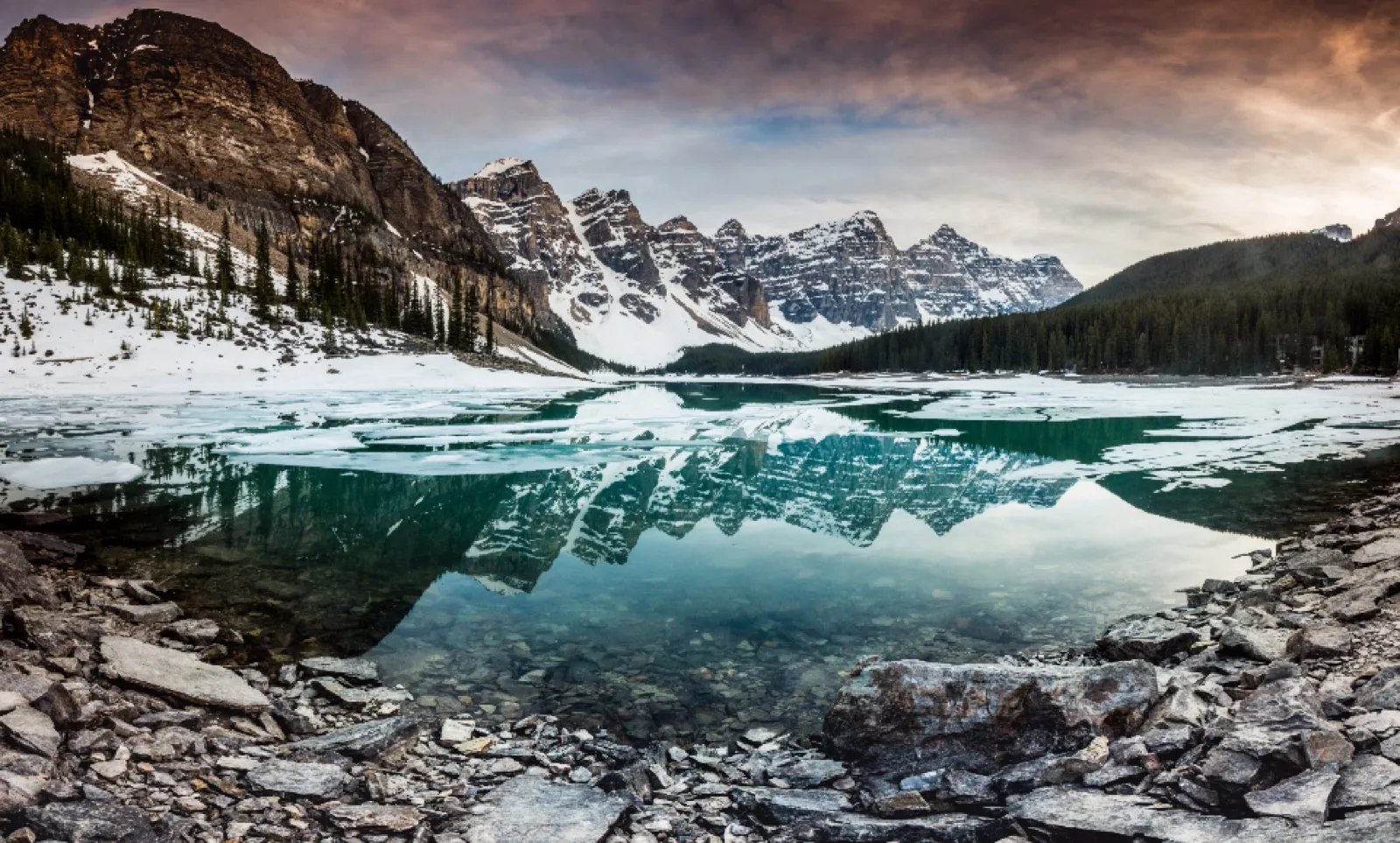 Photographer capturing a snowy winter landscape