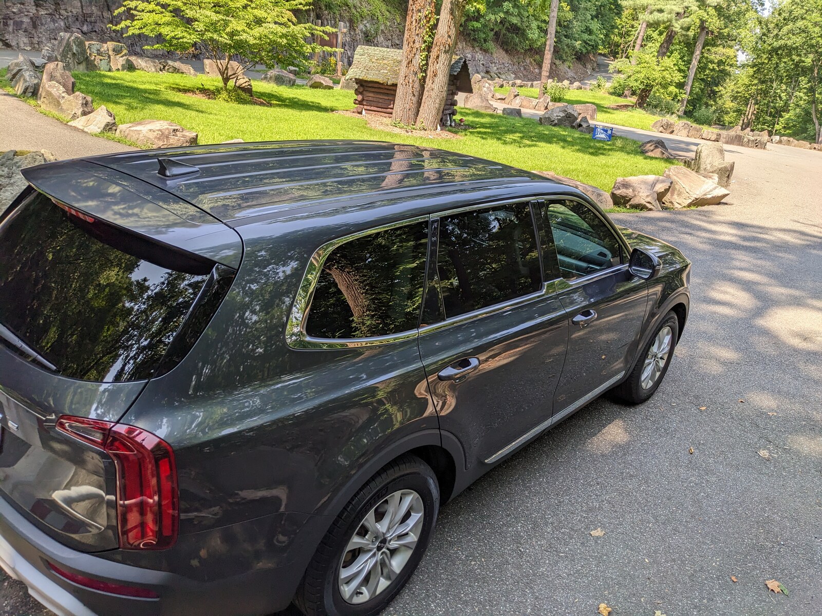 2022 Kia Telluride parked on a shaded park road