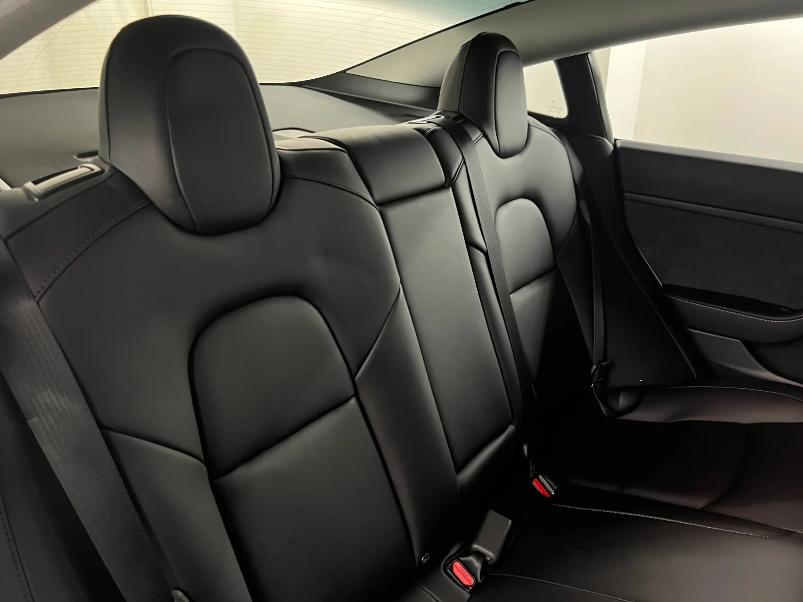Rear seats of the Tesla Model 3 showing the flat floor
